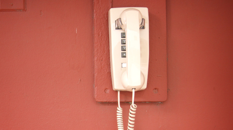 Wired cord telephone mounted on wall
