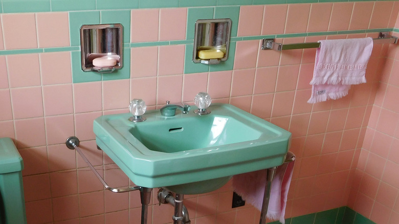 Recessed soap dish and toothbrush holder in a vintage bathroom