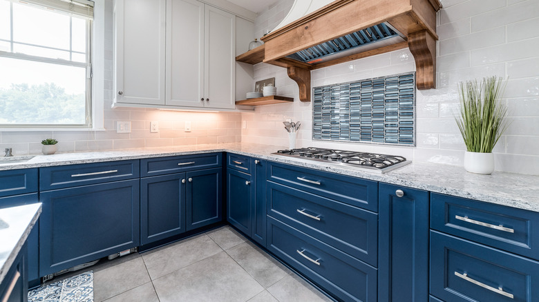 blue kitchen cabinets with corner cabinet