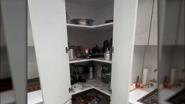 various kitchen appliances in corner cabinet