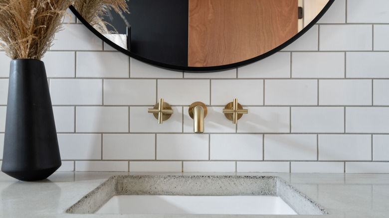 Zoomed in image of bathroom vanity with brass hardware