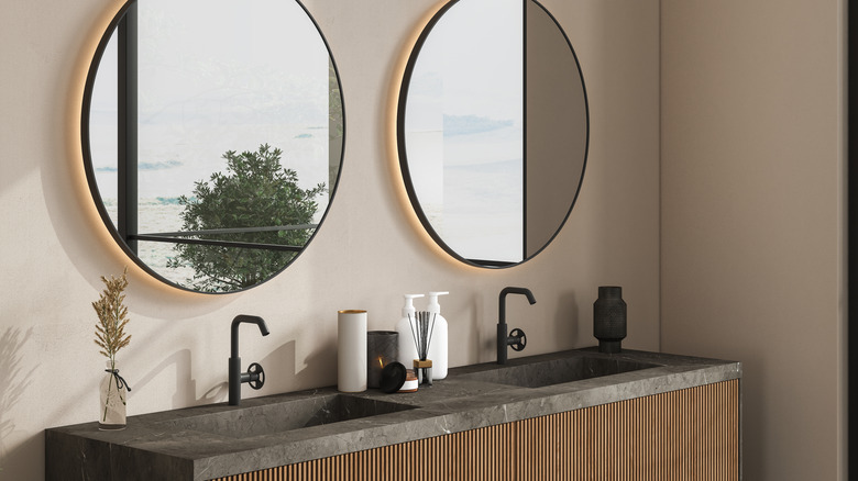 Modern bathroom vanity with two sinks and mirrors