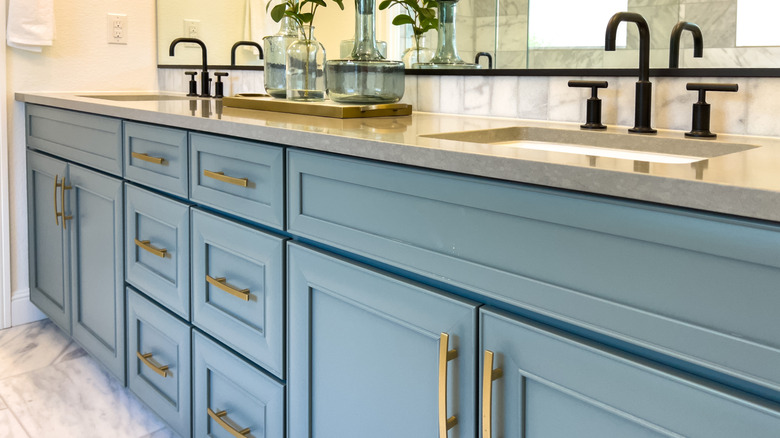 Bathroom vanity with blue cabinets