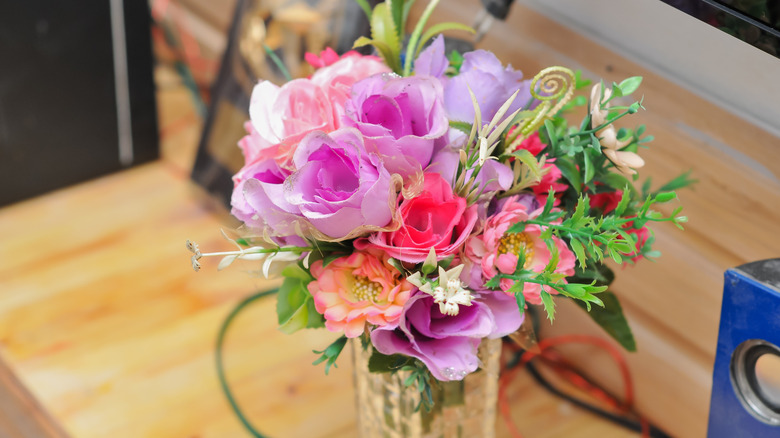 An artificial flower arrangement on a table