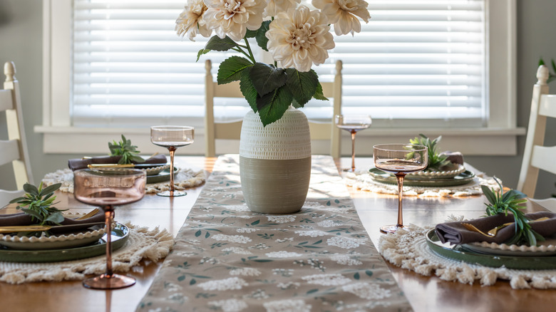 Table runner and place settings on a dining table