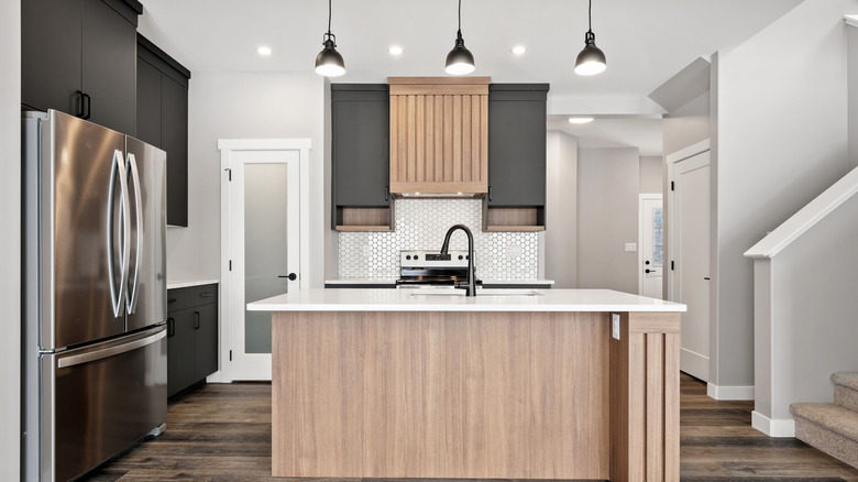 A kitchen with a large refrigerator