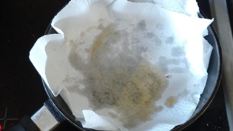 sheets of paper towel in a greasy pan