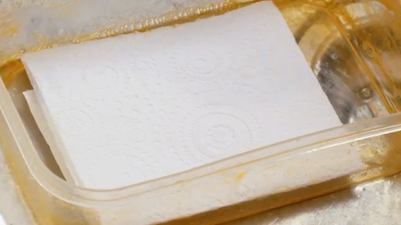 paper towels in a stained container