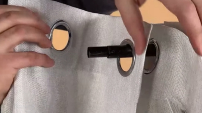 two panels overlap on the curtain rod to offer a more luxury-looking pleated curtain