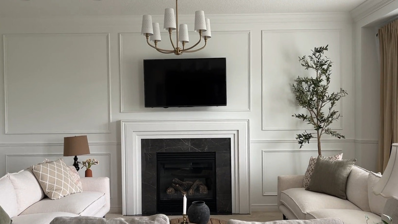 Updated fireplace with simple trim added above it