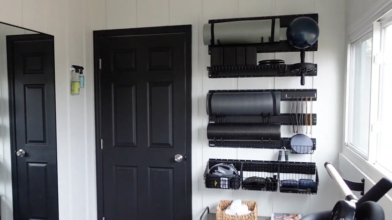 Garage tool rack organizing tools in home gym