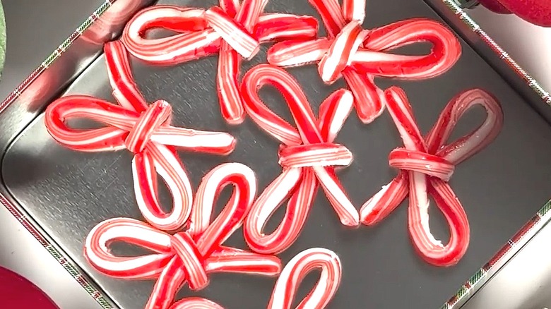 Bows made out of candy canes in a tin container