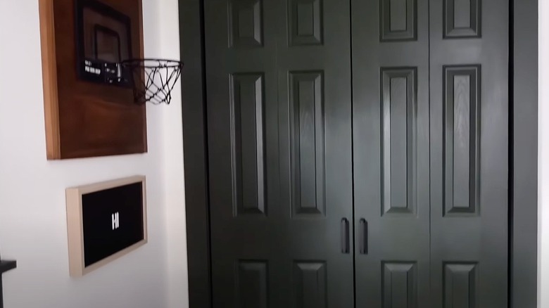 Black bifold closet doors in a bedroom