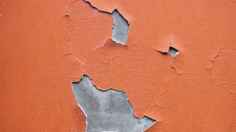 Peeling red paint