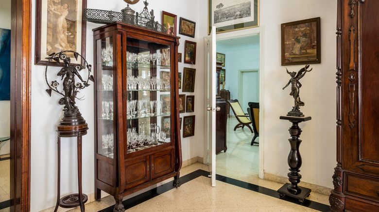 Curio cabinet in corner of room