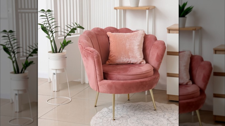 Pink plush chair with pink pillow