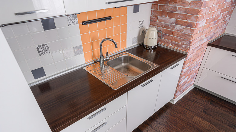 Terracotta tiles with brick in kitchen