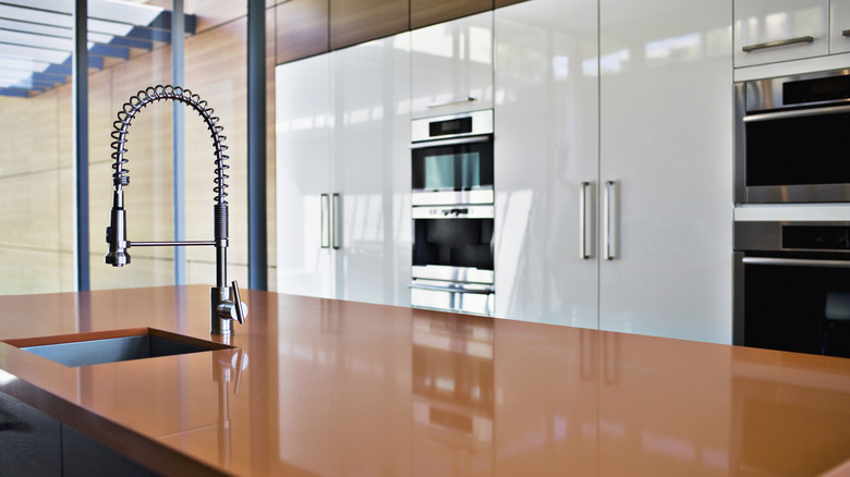 Terracotta mugs in modern kitchen