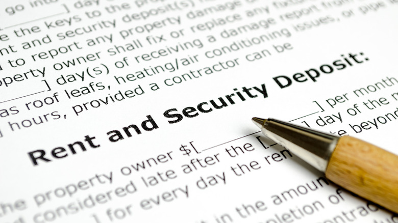 Rent and security deposit with wooden pen