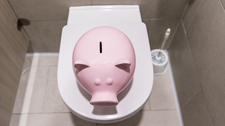Piggy bank on top of toilet