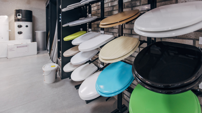 Different types and colors of toilet seats on display