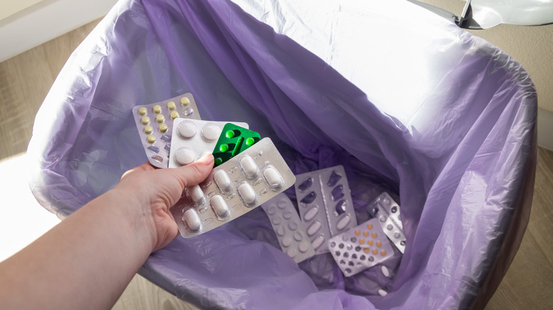 Expired medication being thrown away