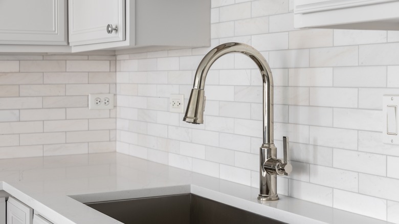 This countertop/backsplash combo features marble and subway tile.