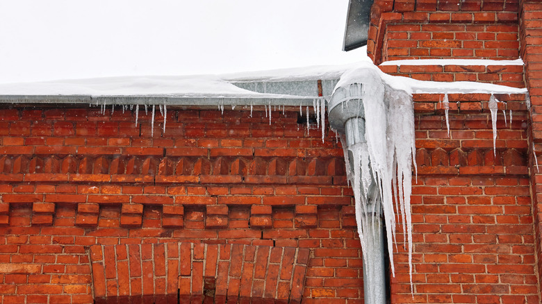 Icicles hanging from a roof and gutter