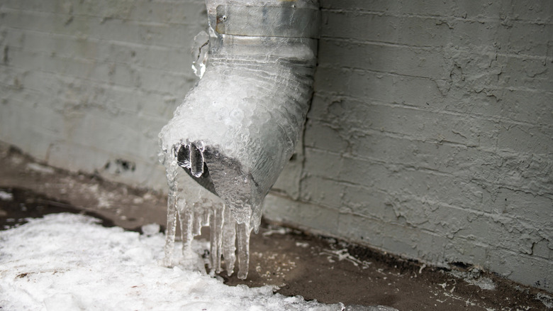Gutter drain completely filled with ice