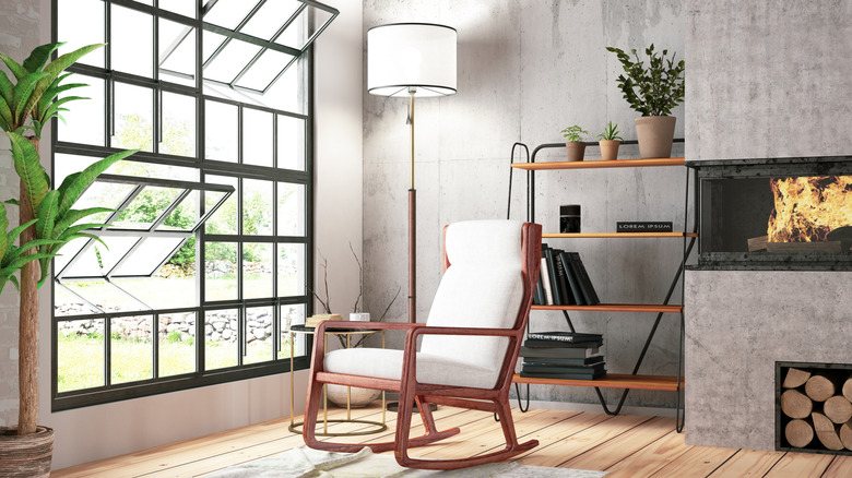 A living room shot with an armchair and a standing floor lamp in the background
