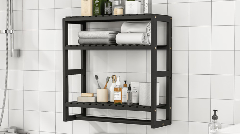 Towels and toiletries organized on Bamworld's Over the Toilet Storage Rack