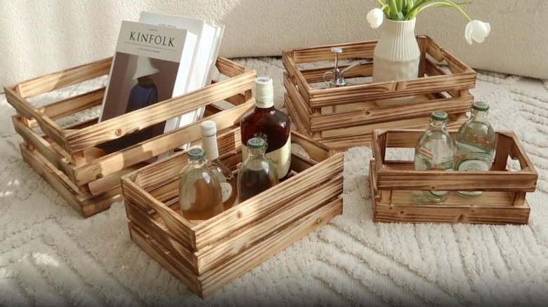 Mode Home's Torched Wood Storage Crates filled with miscellaneous items