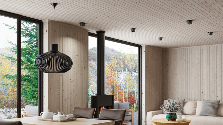 room with pine walls and large modern windows