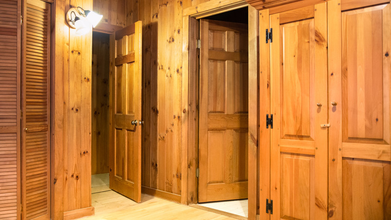 Room with lots of wood paneling