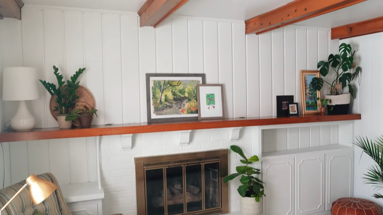 Room with pine paneling painted white