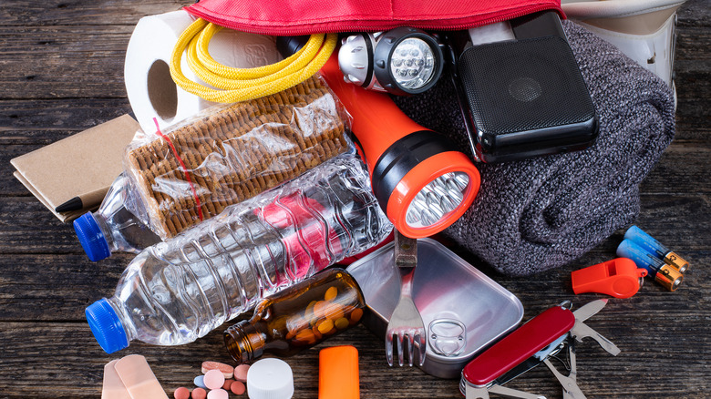Emergency kit including flashlights to prepare for power outages
