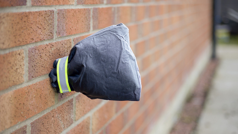 Cover placed over an outdoor faucet