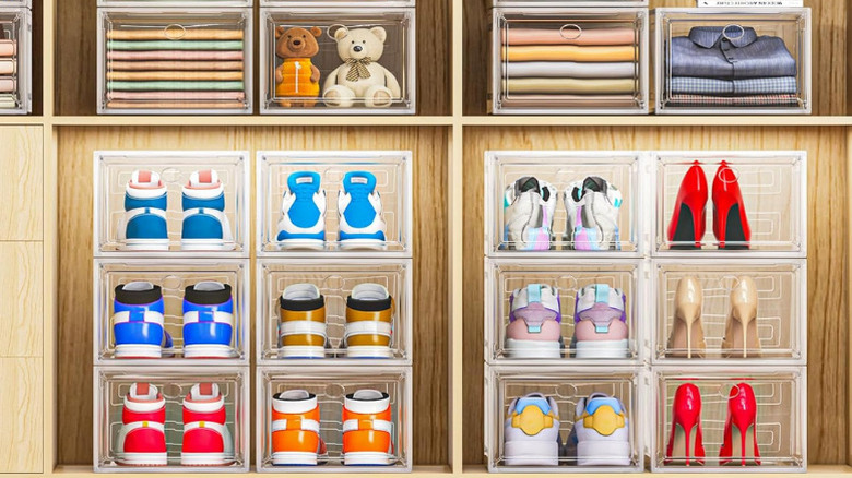 7 Code's Large Clear Shoe Boxes stacked in a wood closet