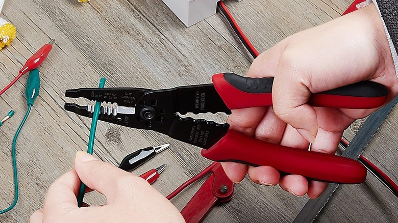 Close-up of a person using WGGE's Professional 8-inch Wire Stripper/Crimping Tool
