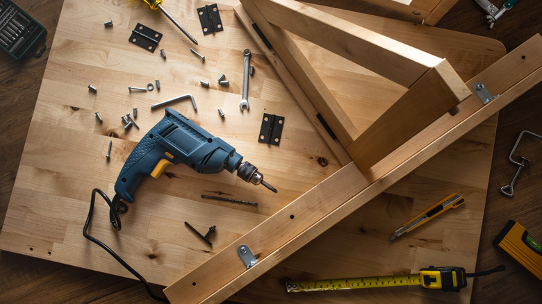 A top-down view of various tools and wood