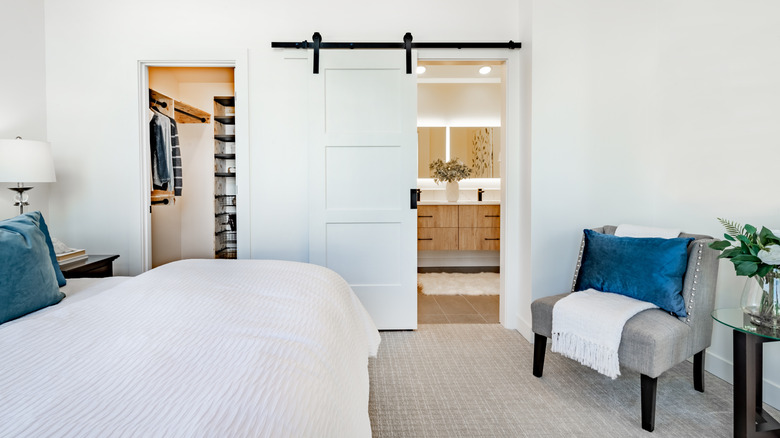 A barn door leading to the room's bathroom