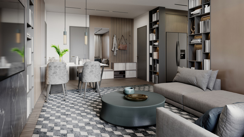 A studio apartment with a small dining area