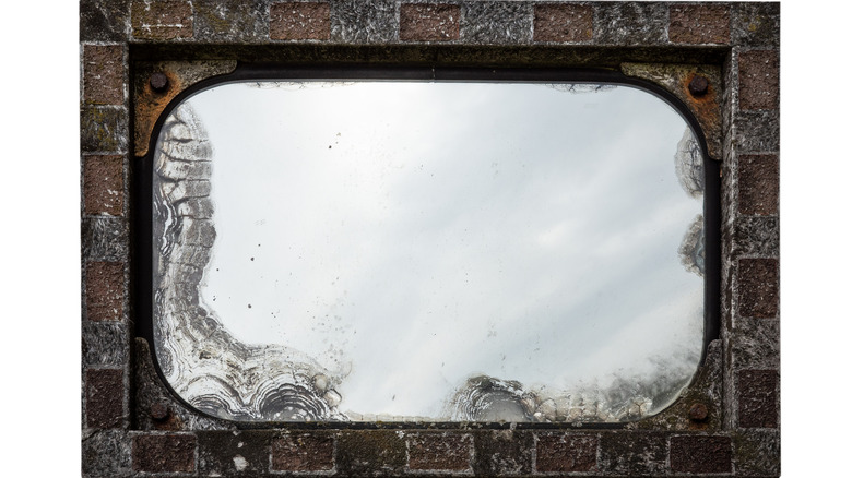 A vintage-style rusty mirror