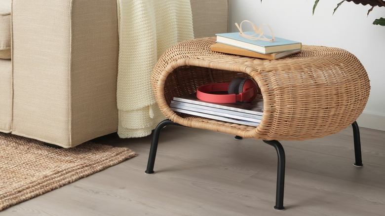 GAMLEHULT Ottoman with storage beside couch in living room