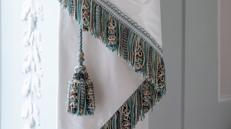 white curtain with fringes