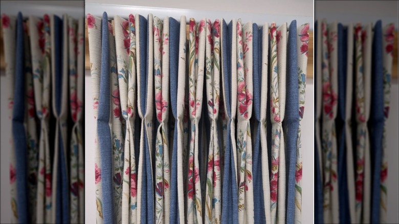 Floral curtains lined with solid blue fabric