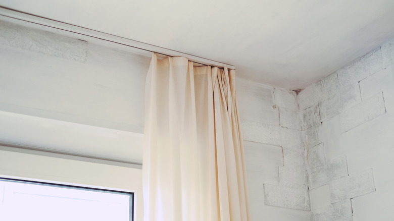 Curtains hung at ceiling height