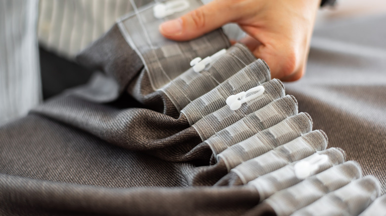 plastic pleat hooks on curtain seam