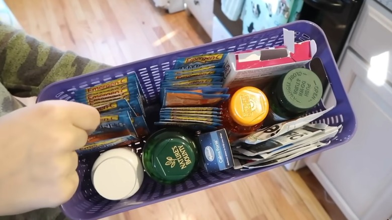 Person holding Dollar Tree long slim storage basket