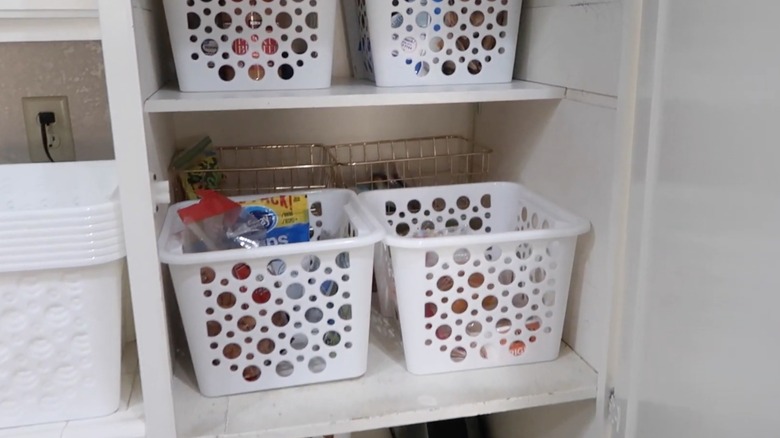 Plastic and metal bin organizers in pantry